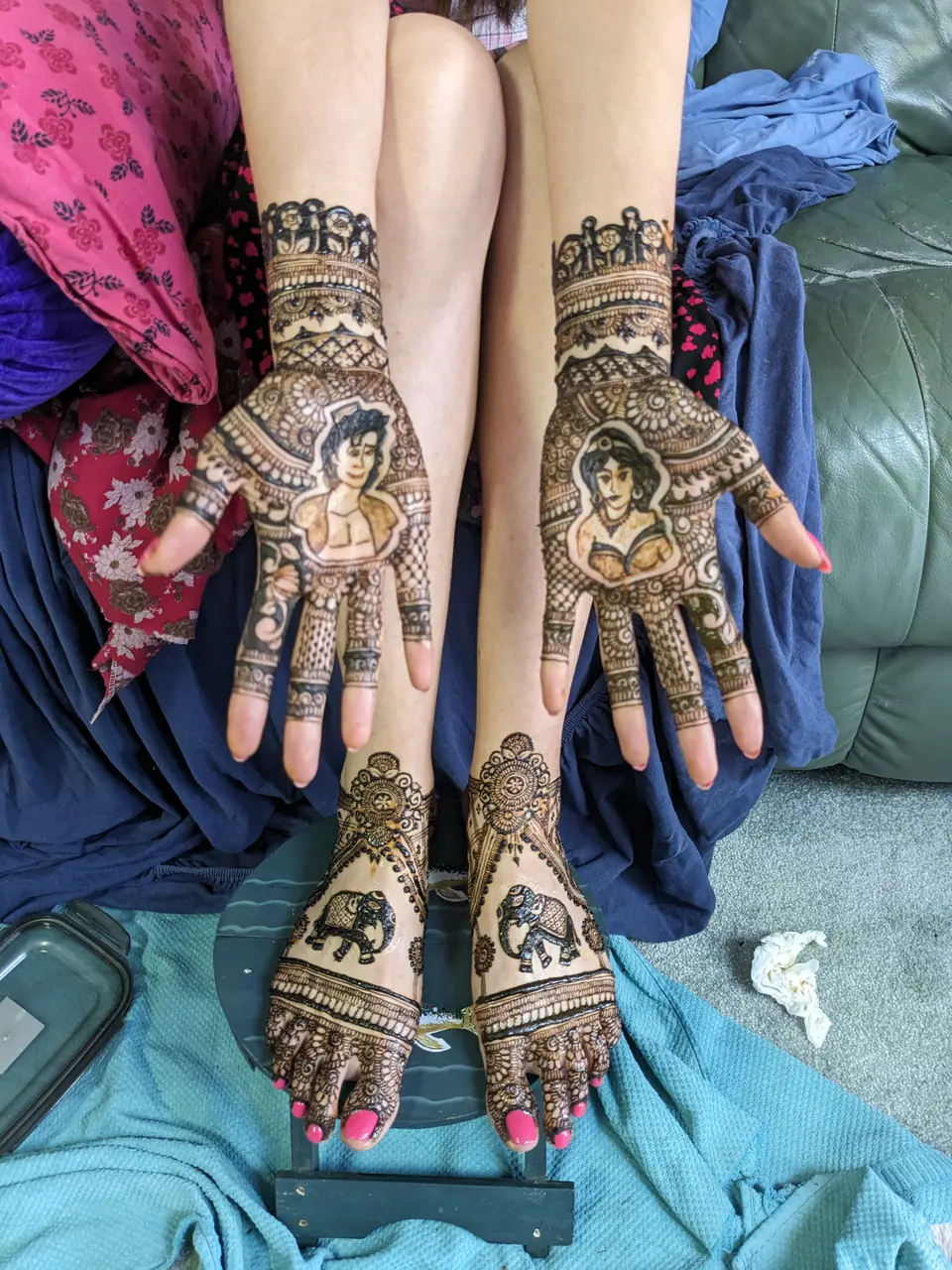 Portrait mehndi of the couple, with elephant designs on the feet