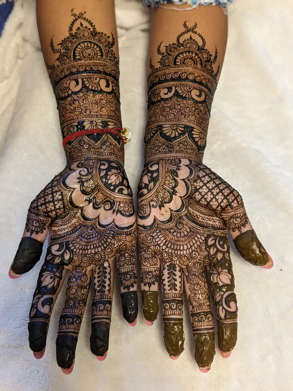 Floral bridal mehndi with lotus and scalloped borders