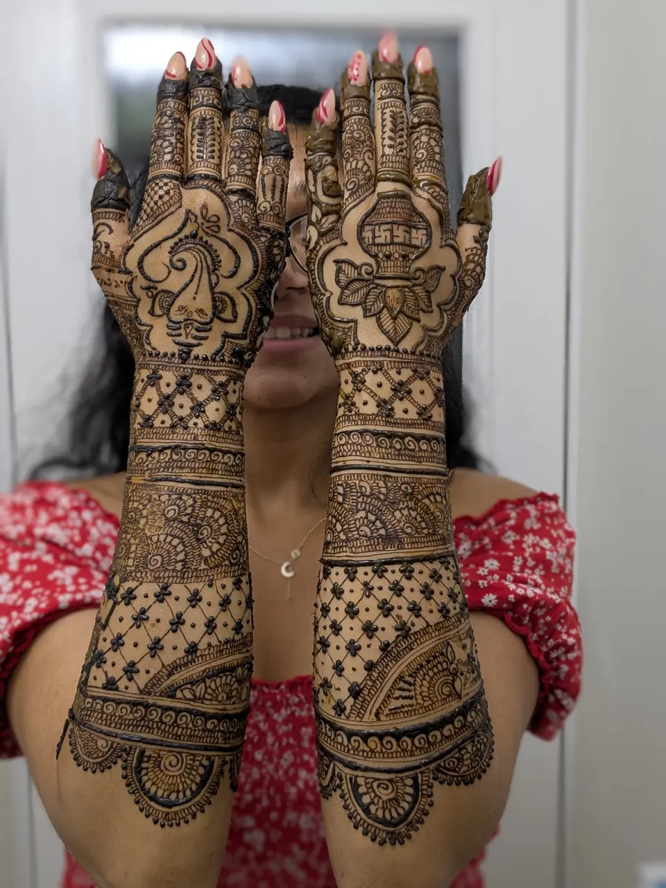 Full-arm bridal mehndi with lanterns and checkered jaali