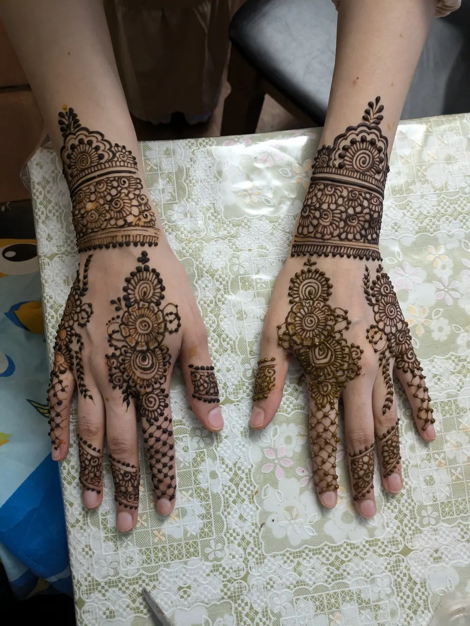 Back-of-hand mandala and lace cuff mehndi
